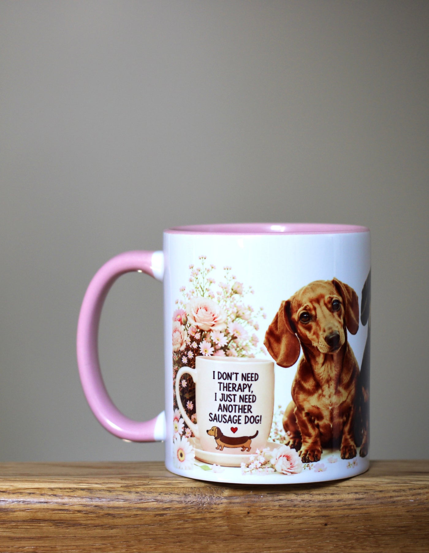 Mug with a dachshund design on a wooden surface with a blurred background